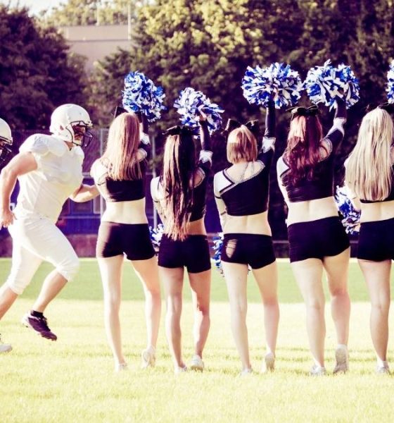 Football Players and Cheerleaders on field